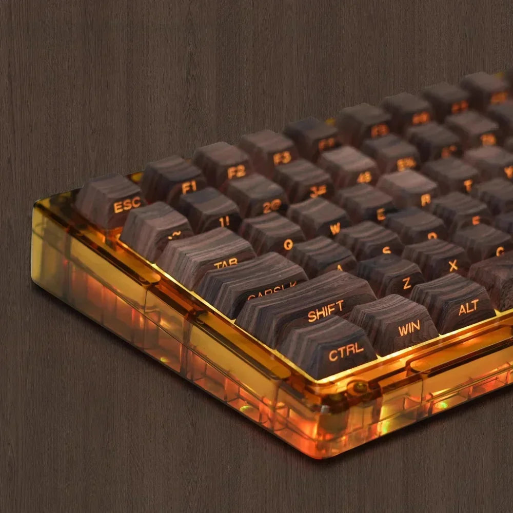 Cherry profile 136-key side-printed wood grain keycap set installed on a mechanical keyboard with transparent case and RGB lighting from an alternate angle